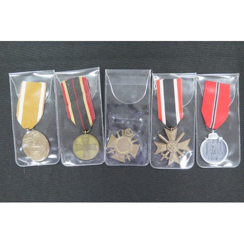 1534 - German WW2 medals including Russian Front, War Merit Cross, War Merit medal, West Wall medal, Cross ... 