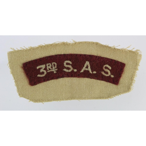 482 - British 3rd SAS shoulder insignia sewn onto khaki fabric.