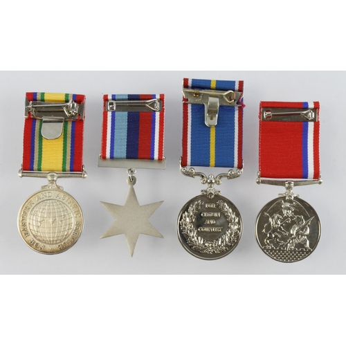 576 - Medal group of four post WW2 with cold war 1945-1991 medal named to 122840587 W/O J.A. Beresford KRR... 