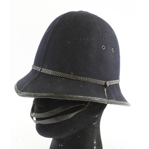 603 - Policeman’s pre WW2 helmet with green lining, brown leather head band with leather chin strap. No ba... 