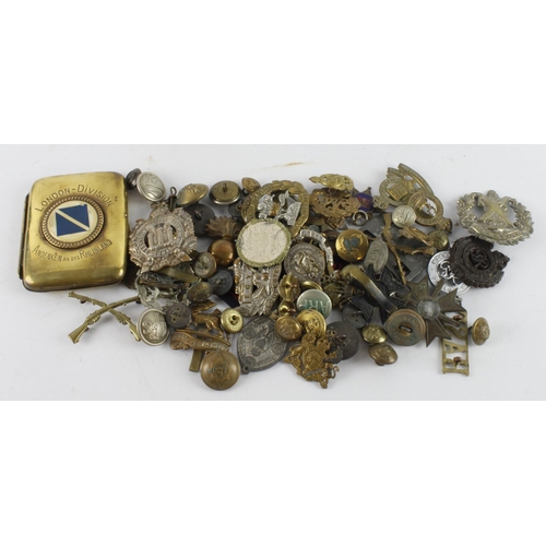 669 - Various British Cap Badges, a couple of medals, and buttons. Noted brass cigarette tin inscribed 'Lo... 