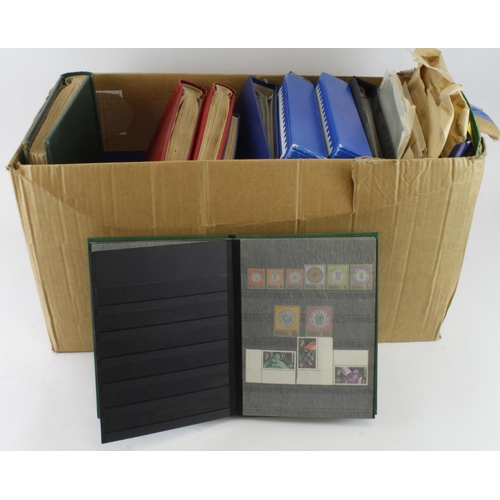 147 - Large box of material including 3x albums of used World, two of GB um and used, two of FDC's and Com... 