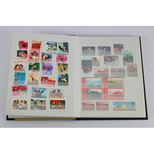 201 - World range in small blue stockbook, several countries noted ie China, Russia, France, Canada, USA a... 