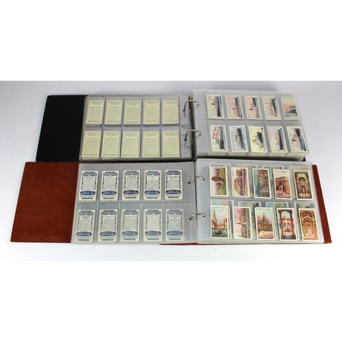 448 - Modern albums (2) of cigarette card sets in sleeves, including Railway Locomotives, Merchant Ships, ... 