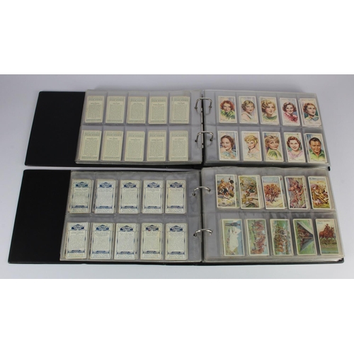 449 - Modern albums (2) of cigarette card sets in sleeves, one album military related including Victoria C... 