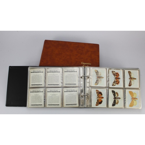 450 - Modern albums (2) of cigarette card sets in sleeves, one album of large size sets incl Old Sundials,... 