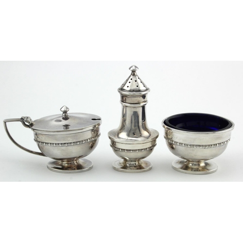 1084 - Three piece cruet set comprising mustard pot, salt & pepper pot (+ two blue glass liners) hallmarked... 