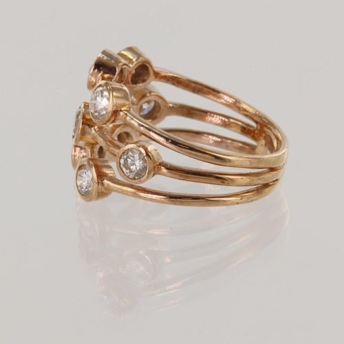 139 - Rose gold (tests 9ct) diamond scatter ring, TDW approx 1.25ct, nine round brilliant cuts, finger siz... 