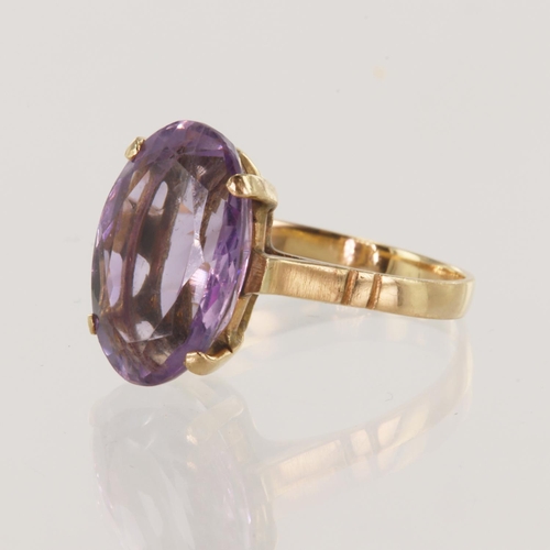 142 - Yellow gold (tests 15ct) amethyst dress ring, one oval amethyst measures 15mm x 10mm, finger size M/... 