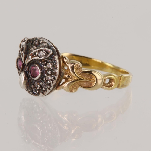 162 - Yellow gold (tests 14ct) owl ring, set with round faceted eyes measuring 2mm, surrounded with fiftee... 