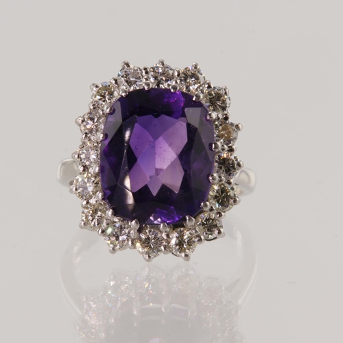 211 - 18ct white gold diamond and amethyst cluster ring, oval mixed cut amethyst measures 13mm x 11mm appr... 