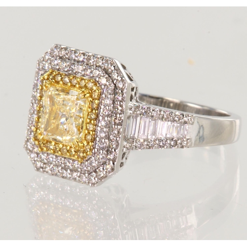 249 - White gold (tests 18ct) fancy yellow diamond triple cluster ring, principle fancy yellow cut approx ... 