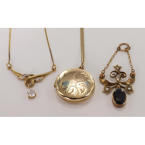 508 - Three 9ct gold/tests 9ct pendants, one round locket with 17