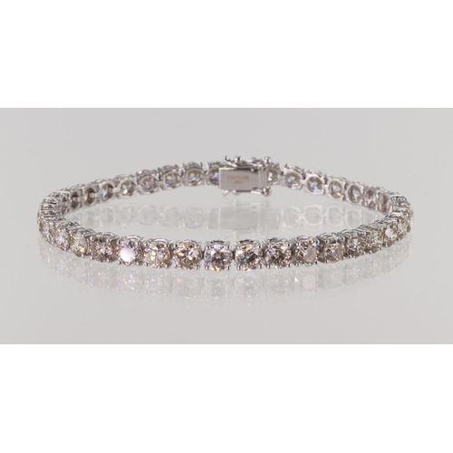 513 - White gold (tests 18ct) diamond tennis bracelet, TDW approx 12.48ct, thirty-nine round brilliant cut... 