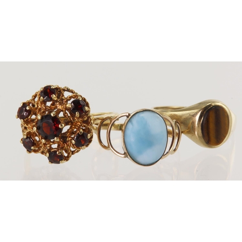 515 - Three 9ct gold/tests 9ct rings, stones include tigers eye, larimar and garnet, finger sizes K, K/L a... 