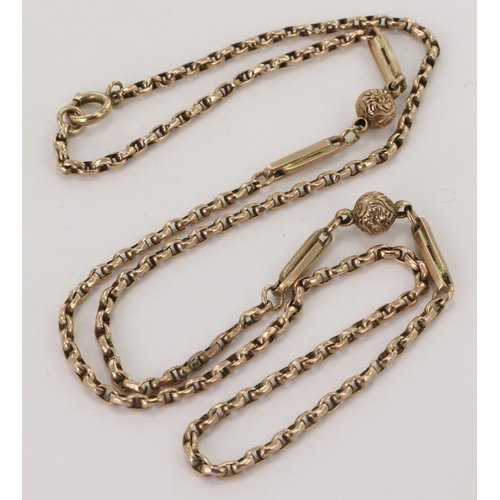 517 - Yellow gold (tests 9ct) antique chain, belcher links with elongated links and engraved ball design, ... 