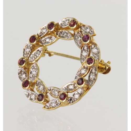 525 - 9ct yellow gold diamond and ruby wreath brooch, ten approx 1.6mm rubies spaced inbetween diamonds in... 