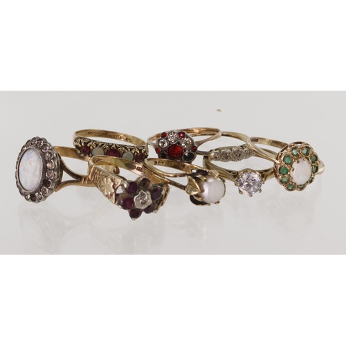 532 - Eight 9ct gold/tests 9ct rings, stones include diamond, ruby, emerald, opal, zircon, paste and simul... 