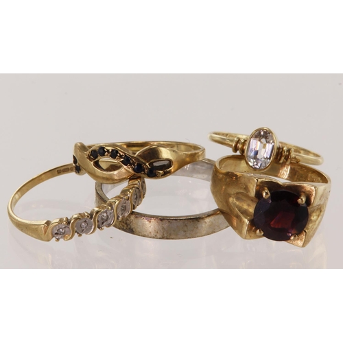 534 - Five 9ct gold/ tests 9ct rings, stones include diamond, sapphire, garnet and ziron, total weight 11.... 