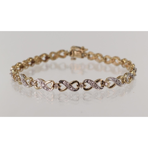 535 - 9ct yellow gold diamond bracelet, diamond set heart shaped inifinity links spaced with single cut di... 