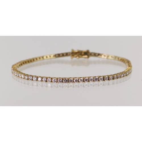 543 - Yellow gold (tests 18ct) diamond tennis bracelet, seventy-five round brilliant cut diamonds TDW appr... 