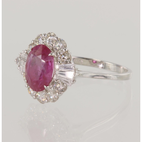 62 - White gold (tests 18ct) diamond and ruby cluster ring, oval ruby measures 9mm x 7mm approx 2.30ct, s... 