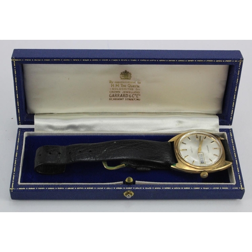 848 - Gents 9ct cased Garrard automatic wristwatch. The silver dial with gilt baton markers. Case width ap... 