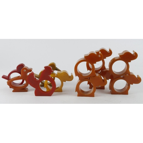 400 - Napkin Rings. A group of eleven novelty bakelite napkin rings, depicting animals, including a matchi... 