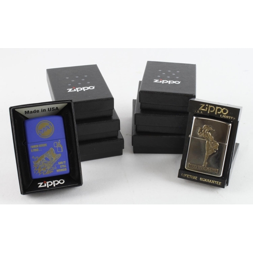 428 - Zippo. Eight cased Zippo lighters, including Berlin Wall, 1935 Varga Girl, Flower Power, New York, P... 