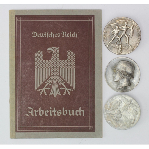 1289 - German work book and home front badges.