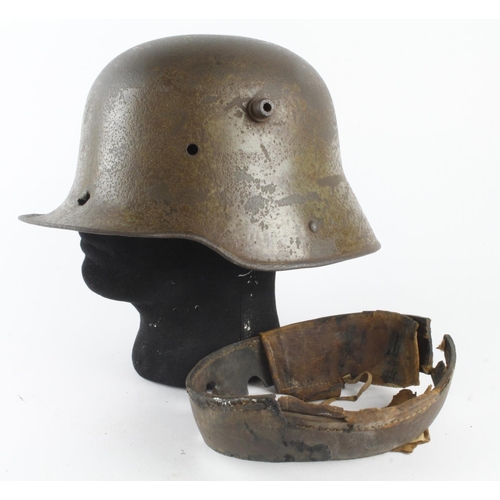 1291 - German WW1 1916 pattern steel helmet with a bullet Hole through the front and out the back complete ... 