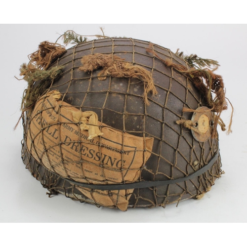 1497 - British WW2 Paratroopers steel helmet, netting with first aid pouch, 1943 BMB dated liner, leather s... 