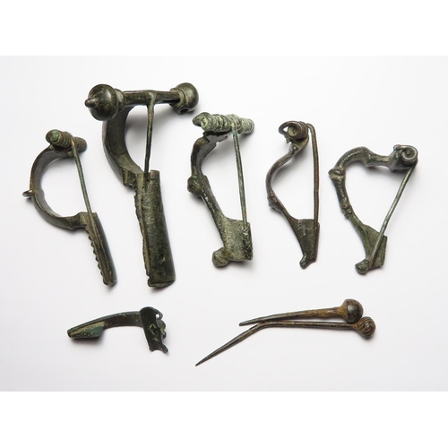 350 - Antiquities: Roman bronze fibula brooches (6) 40mm to 80mm, and pins (2) 50-75mm.