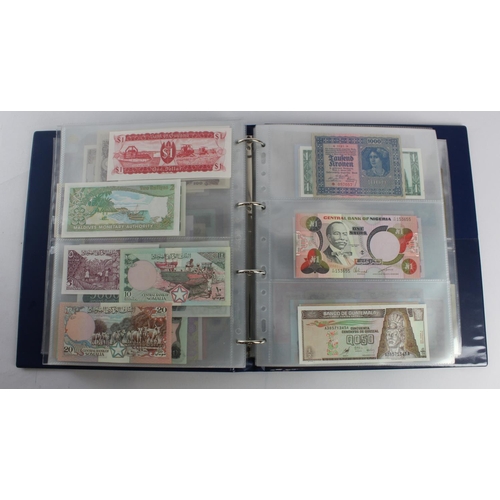 931 - World (280+), an album of mixed world notes to include Bermuda 1 Pound 1957, East Africa 1 Shilling ... 