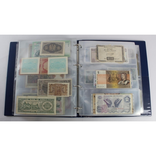 931 - World (280+), an album of mixed world notes to include Bermuda 1 Pound 1957, East Africa 1 Shilling ... 