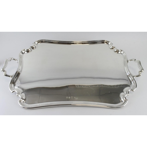 1009 - Large twin handled silver tray, hallmarked 'Atkin Brothers, London 1915' (rubbed), engraved to rever... 