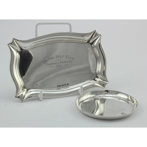 1085 - Pair of silver ashtrays comprising one  hallmarked FJ&S Birm. 1931 inscribed 