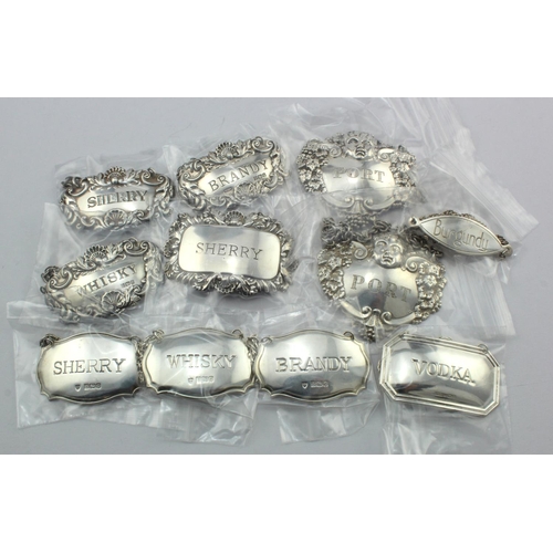 1128 - Decanter labels. eleven various silver hallmarked decanter labels, weight 4.4oz. approx.