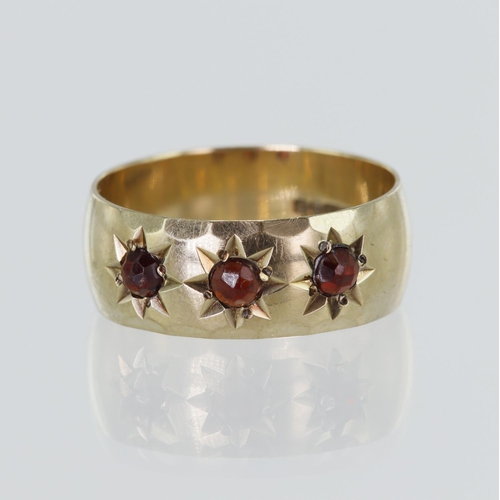 115 - 9ct yellow gold garnet gypsy ring, set with three rose cut garnets, width 7.5mm, finger size Q/R, we... 