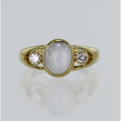 19 - Yellow gold (tests 18ct) star sapphire and CZ ring, oval cabochon star sapphire approx. 4.67ct, meas... 