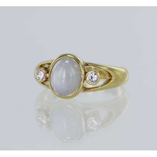 19 - Yellow gold (tests 18ct) star sapphire and CZ ring, oval cabochon star sapphire approx. 4.67ct, meas... 