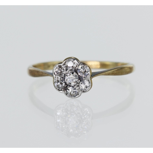 28 - Yellow gold (tests 18ct) vintage diamond daisy cluster ring, set with seven old cut diamonds TDW app... 