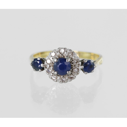 29 - Yellow gold (tests 18ct) sapphire and diamond ring, principal sapphire measures 4mm surrounded by si... 