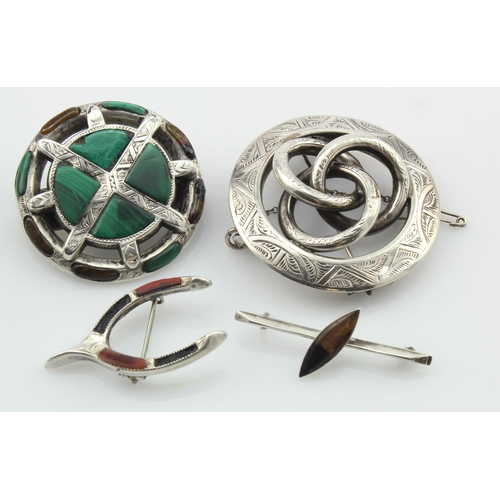 318 - Four silver/tests 925 mainly Scottish brooches, stones include malachite, agate, blue john and paste... 