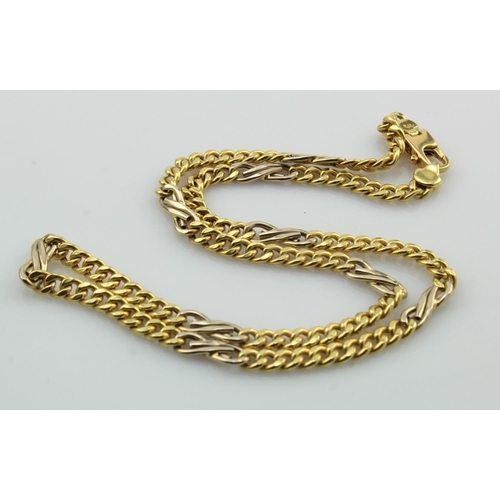 350 - Yellow gold (tests 18ct) curb chain with nine white gold infinity links, length 16