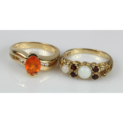 354 - Two rings 9ct gold/tests 9ct. Stones include diamond, fire opal, opal and garnet, finger sizes N/O a... 