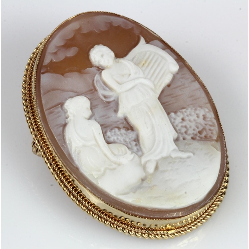 368 - 9ct yellow gold carved shell cameo brooch, depicting a maiden playing a harp, measuring 40mm x 30mm,... 