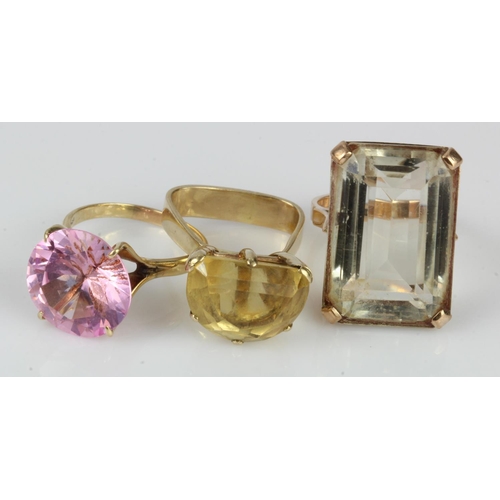 380 - Three yellow gold (tests 9ct) dress rings, stones include citrine and CZ, finger sizes N/O, P/Q and ... 