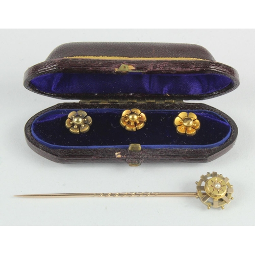 390 - Yellow gold (tests 18ct) dress studs and tie pin, three floral dress studs cased with a seed pearl s... 