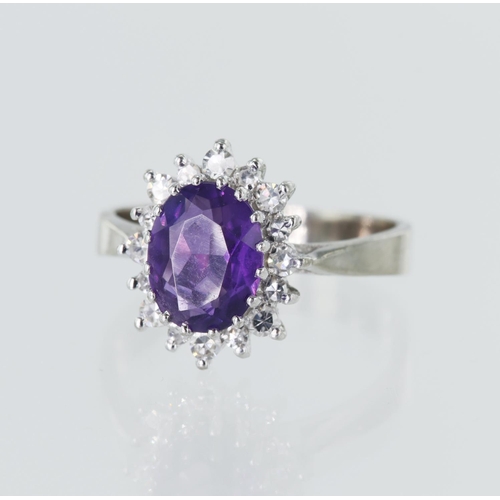 4 - 18ct white gold diamond and amethyst cluster ring, oval amethyst measures approx. 9mm x 7mm, surroun... 